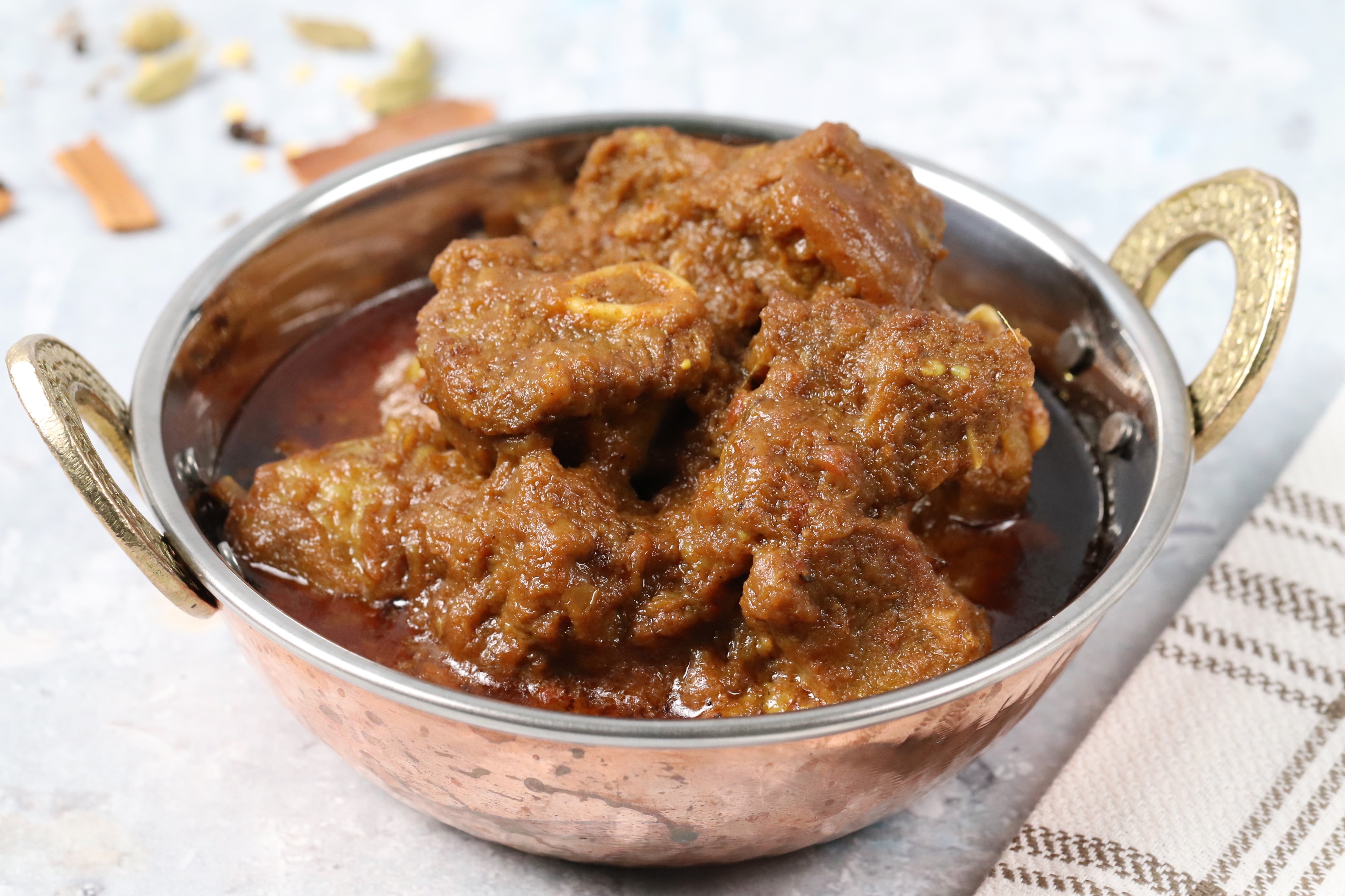 Goat Bhuna - Tender baby goat curry slow-cooked with Bengali spices